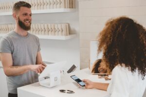 Man serving customer.